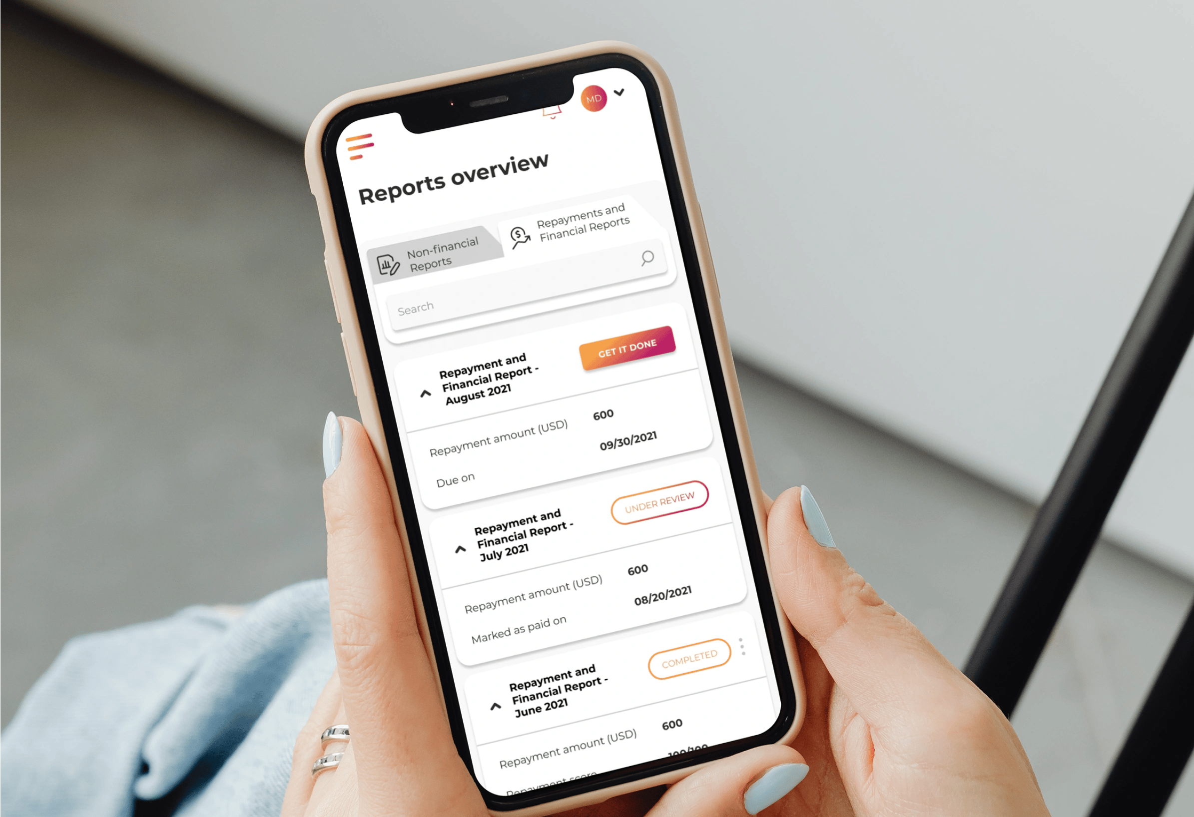 Picture of a person's hands holding a smartphone. On the phone's screen there is a view from the Uncap investment platform, with the heading "Reports overview," a search bar, and several components showing the status of different documents. 
